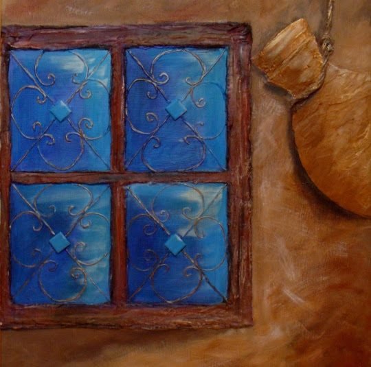 A blue window with wrought-iron grille set in an ochre wall beside a clay pot