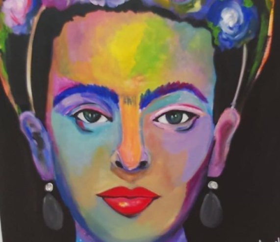 Frida Kahlo painted in a spectrum of colour, red lips and flowers in her hair