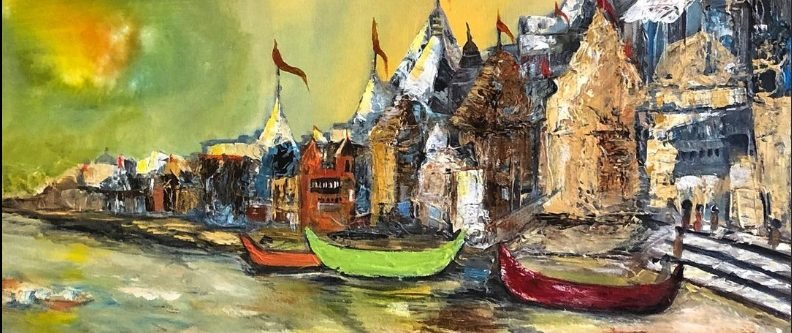 The ghats of Varanasi with temples and boats along the river