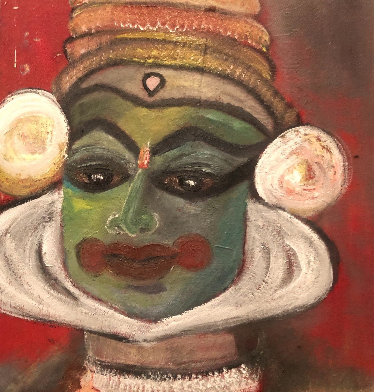 Painterly Kathakali face in green with the white chutti frame around the jaw