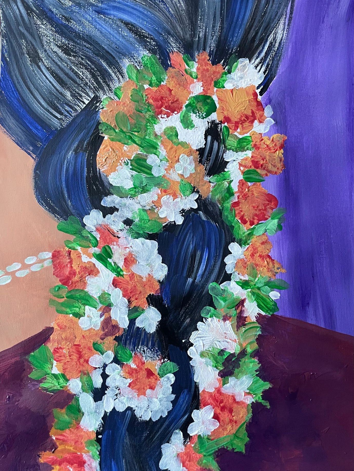 A long braid woven with jasmine and pink flowers against violet