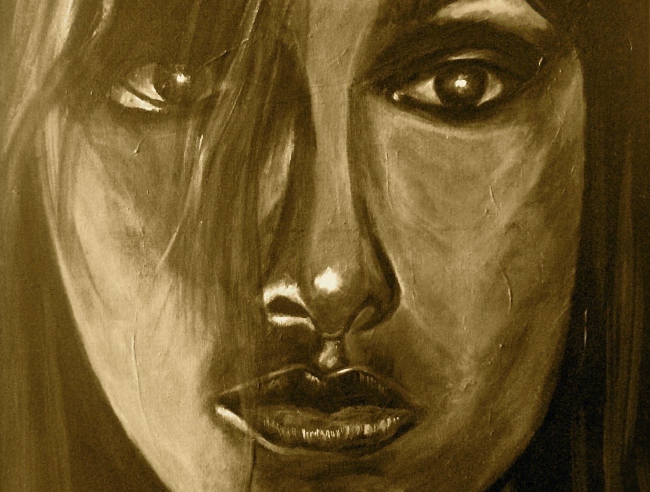 Sepia close-up of a woman’s face, strands of hair across her eyes