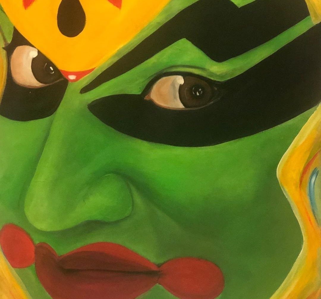 Extreme close-up of a Kathakali performer’s eyes, ringed in black on a vivid green face