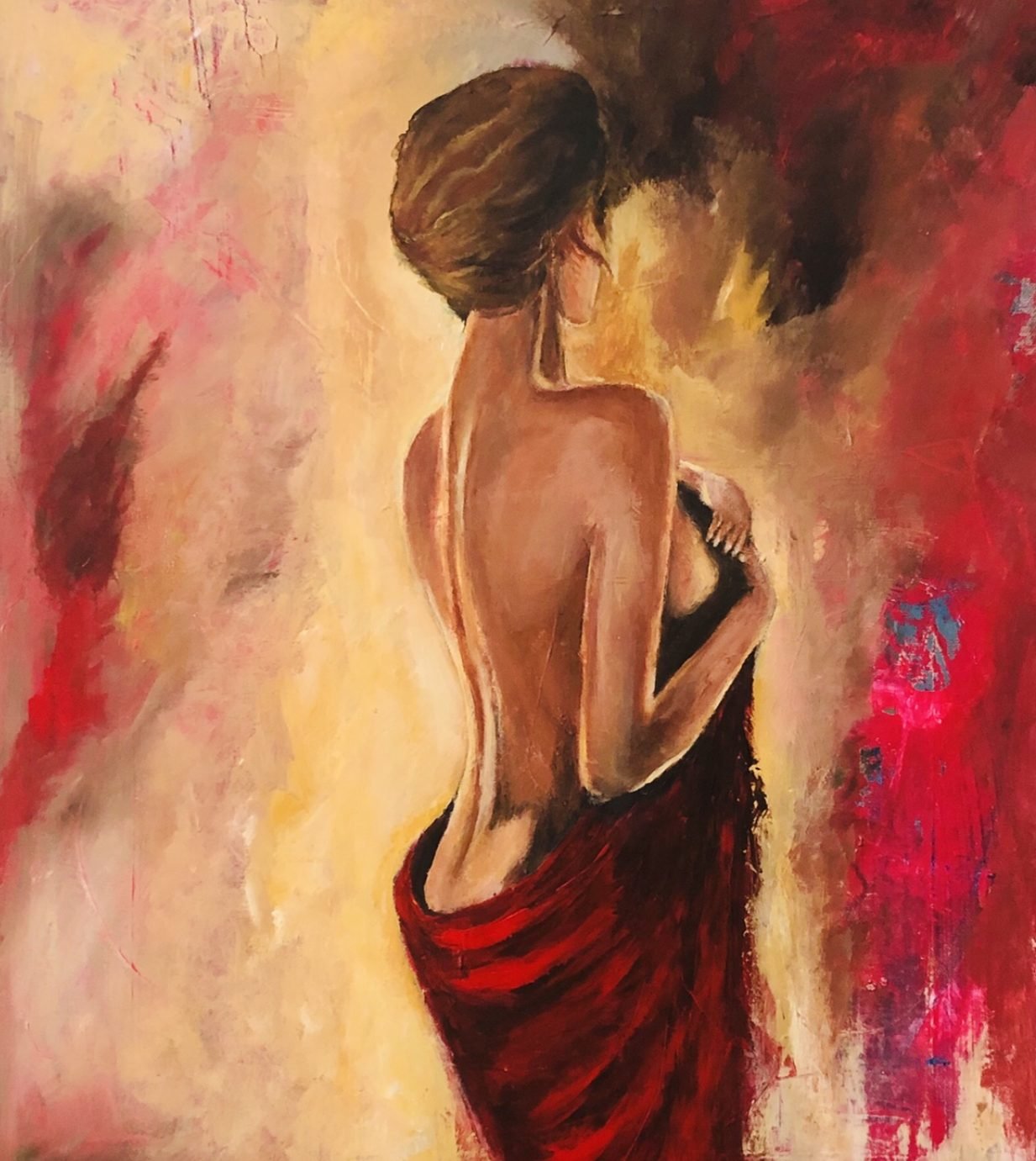 A woman seen from behind, bare-shouldered, wrapped in red cloth